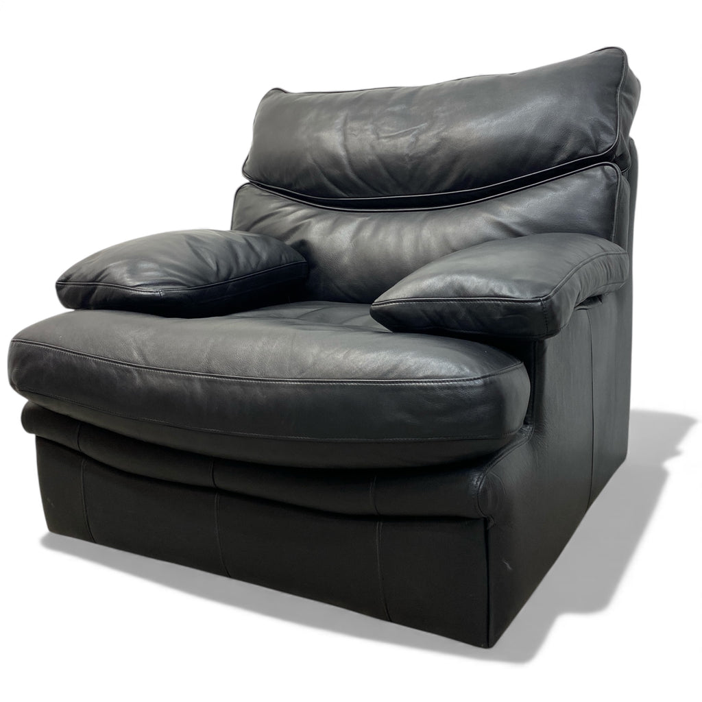 Black leather armchair on a white background