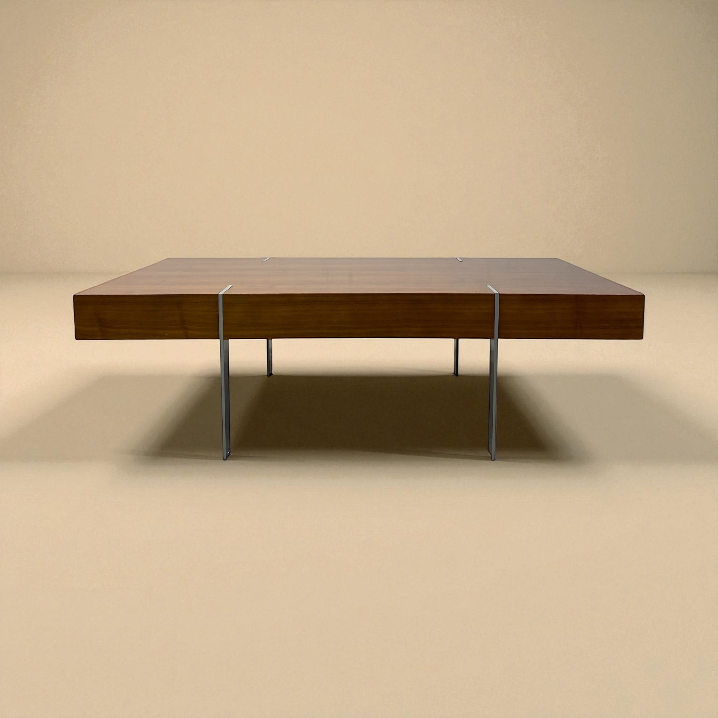 Wooden table with metal legs on a beige background