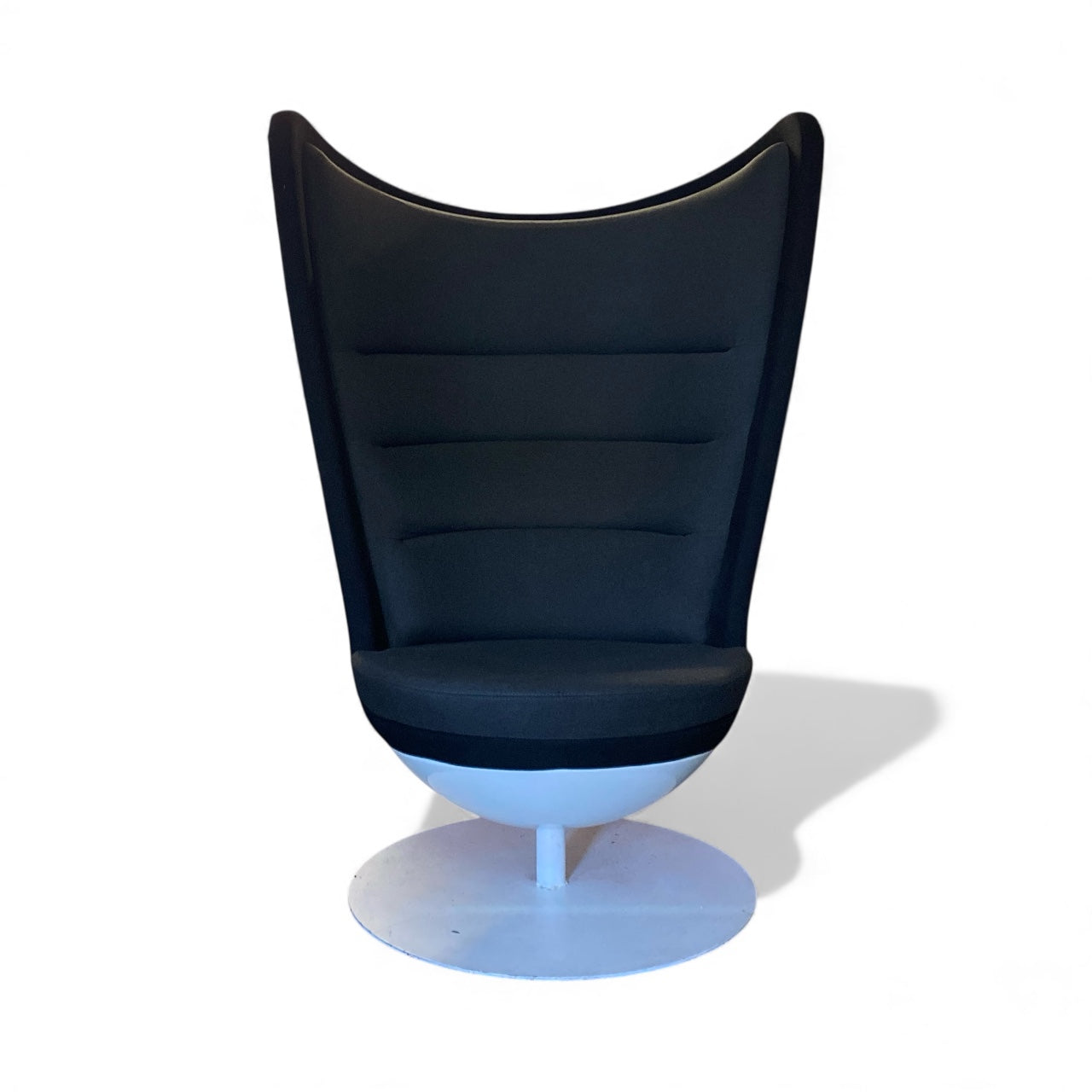 Modern black chair with a white base on a white background