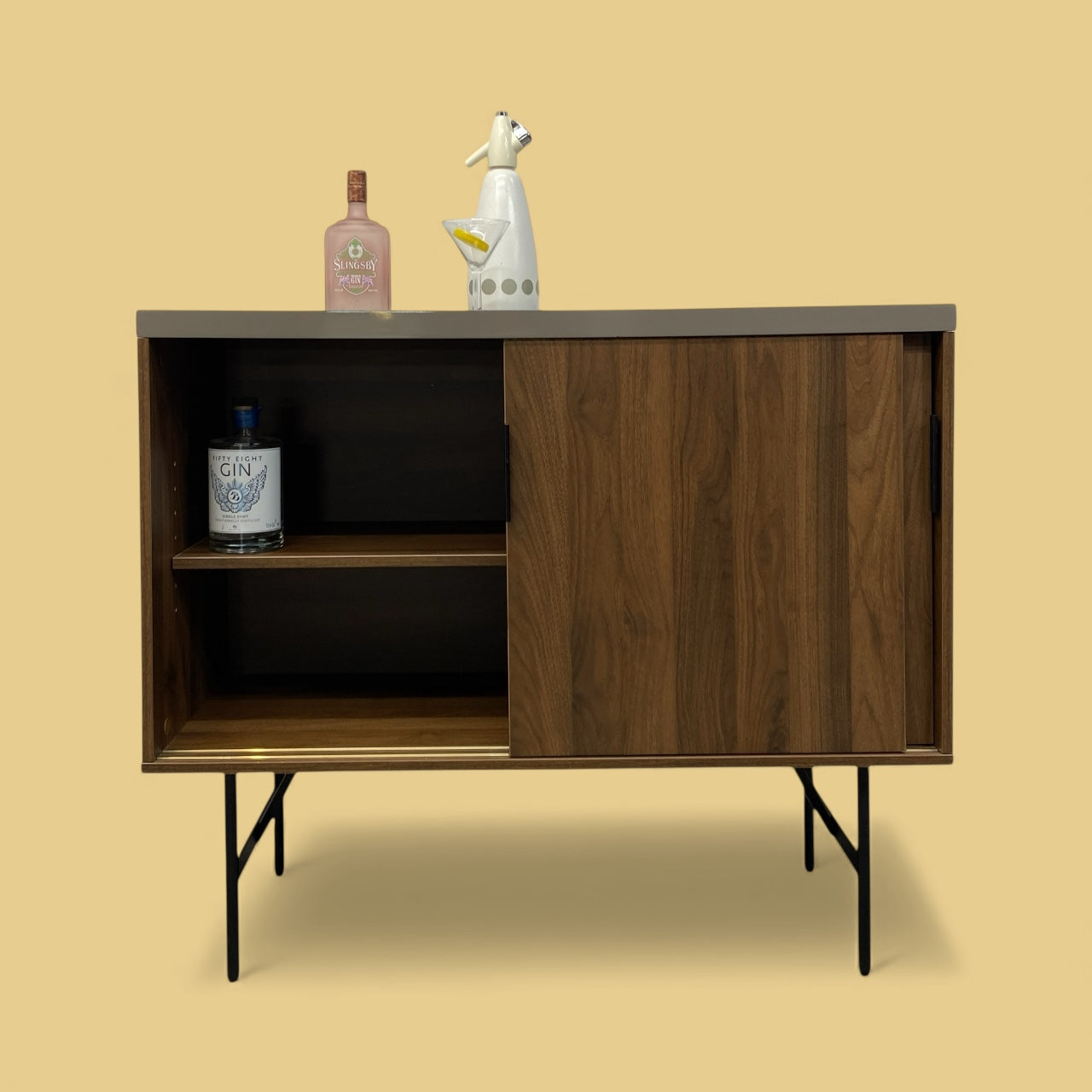 Wooden cabinet with decorative items on a beige background