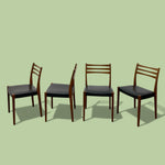 Load image into Gallery viewer, FOUR DINING CHAIRS ON A GREEN BACKGROUND
