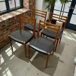 Load image into Gallery viewer, TEAK AND VINYL CHAIRS IN A LIGHT FILLED ROOM 
