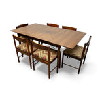 Load image into Gallery viewer, Wooden dining table with six chairs on a white background
