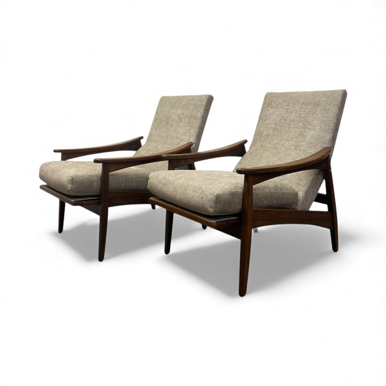 TWO LOUNGE CHAIRS WITH WOODEN ARMS AND A FABRIC UPHOLSTERY