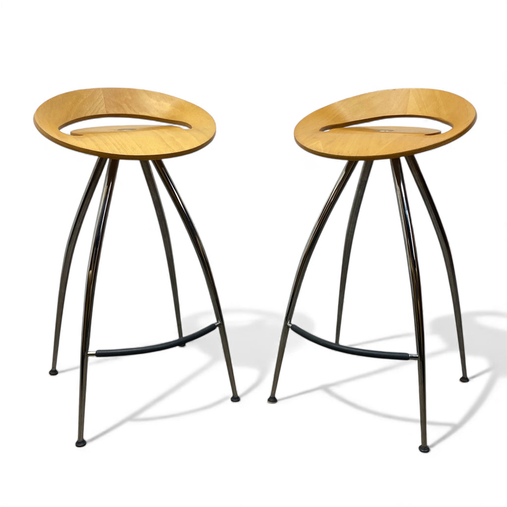 Two wooden stools with black metal legs on a white background