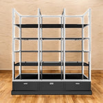 Load image into Gallery viewer, Metal shelving unit with black shelves and drawers on a wooden floor.
