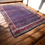 Load image into Gallery viewer, Decorative rug with intricate patterns on a wooden floor
