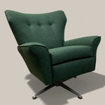Load image into Gallery viewer, Green armchair with a swivel base on a beige background
