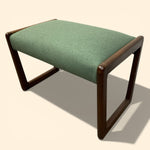 Load image into Gallery viewer, Green cushioned stool with wooden frame on a beige background

