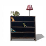 Load image into Gallery viewer, Wooden bookshelf with books and a lamp on a white background
