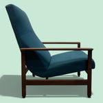 Load image into Gallery viewer, Blue armchair with wooden frame on a light green background
