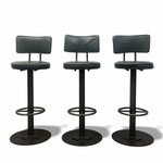 Load image into Gallery viewer, Three black bar stools cushioned seats on a white background

