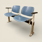 Load image into Gallery viewer, Pair of blue seats with metal frames on a beige background
