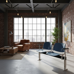 Load image into Gallery viewer, Modern waiting room with brick walls, large windows, and a brown leather sofa.
