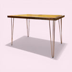 Load image into Gallery viewer, Wooden table with metal hairpin legs on a white background
