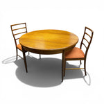 Load image into Gallery viewer, Wooden dining table with two chairs on a white background
