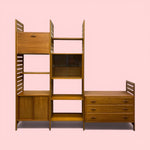 Load image into Gallery viewer, A SHELVING SYSTEM ON A PINK BACKGROUND
