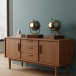 Load image into Gallery viewer, Wooden sideboard with two decorative lamps on a teal wall background
