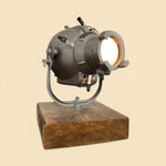 Load image into Gallery viewer, Vintage-style spotlight on a wooden base against a beige background

