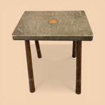 Load image into Gallery viewer, Small square table with a textured green surface and wooden legs on a beige background

