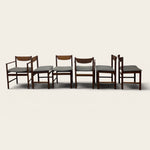 Load image into Gallery viewer, Set of six wooden chairs with gray cushions on a white background
