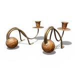 Load image into Gallery viewer, Pair of decorative candle holders with curved metal designs on a white background
