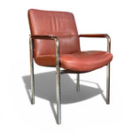 Load image into Gallery viewer, Brown leather chair with chrome frame on a white background
