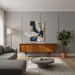 Load image into Gallery viewer, Modern living room with gray sofa, wooden sideboard, abstract painting, and potted plant.
