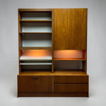 Load image into Gallery viewer, Wooden bookshelf with open shelves and a closed door on a gray background
