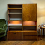 Load image into Gallery viewer, Wooden bookshelf with a green armchair on a wooden floor.
