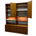 Load image into Gallery viewer, Wooden bookshelf with open doors on a white background
