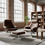 Load image into Gallery viewer, Two brown leather swivel lounge chairs with matching ottomans in a modern loft-style room with brick walls, large windows, and a wooden bookshelf.
