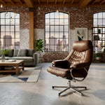 Load image into Gallery viewer, A brown leather swivel lounge chair with a chrome five-star base, positioned in a modern loft-style living room with brick walls, large windows, and a gray sofa.
