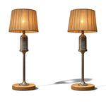 Load image into Gallery viewer, Two matching table lamps with pleated beige fabric shades, brushed metal bases, and round wooden feet, shown side by side on a white background.
