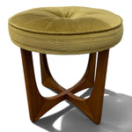 Load image into Gallery viewer, A round tufted stool with a textured green fabric cushion and a mid-century modern wooden base, shown on a white background with a soft shadow.
