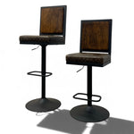 Load image into Gallery viewer, Two modern bar stools with dark wood grain backrests, patterned brown and black seat cushions, and black metal pedestal bases with footrests, shown on a white background.
