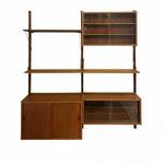 Load image into Gallery viewer, Mid-century modern wooden wall-mounted shelving unit with glass-front cabinets and open shelves, shown against a plain white background.

