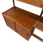 Load image into Gallery viewer, Mid-century modern wooden cabinet and shelving unit in warm medium brown wood grain, shown on a plain white background.
