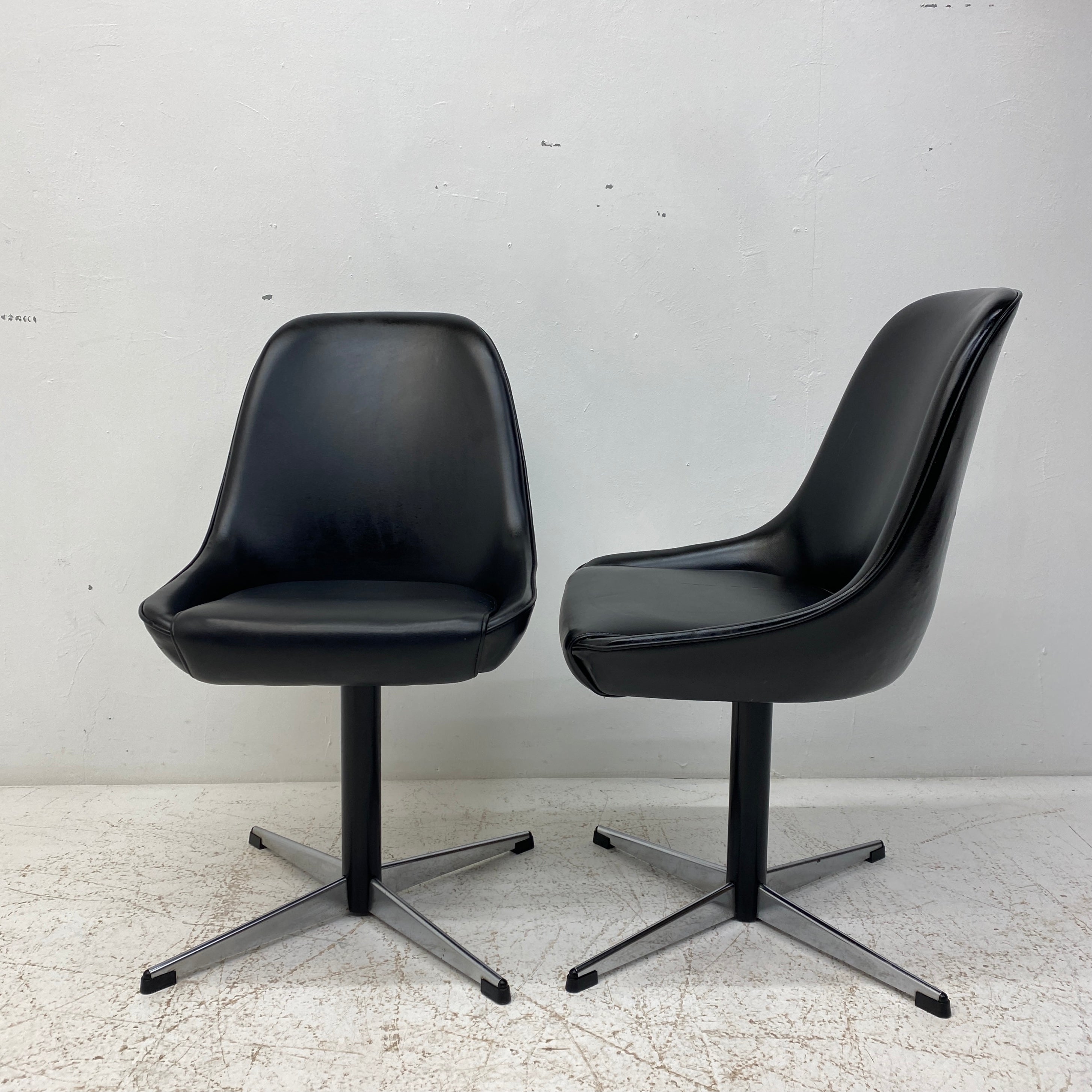 Side And Front Of Black Vinyl Swivel Chairs