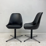 Load image into Gallery viewer, Side And Front Of Black Vinyl Swivel Chairs
